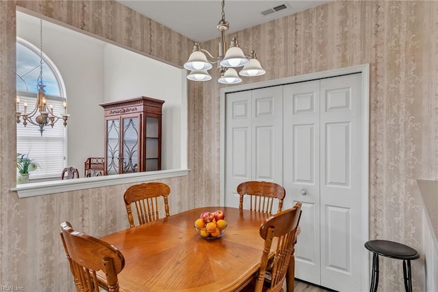 1010 Legends Way, Suffolk, VA 23435 - dining area with a chandelier and wallpapered walls