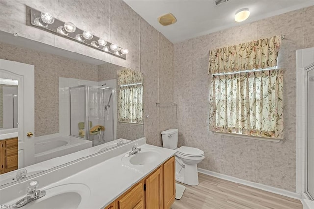 1010 Legends Way, Suffolk, VA 23435 - bathroom featuring a stall shower, double vanity, wood finished floors, and a bath
