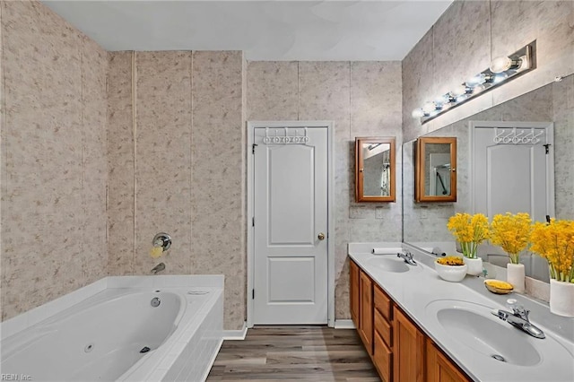 1010 Legends Way, Suffolk, VA 23435 - full bath with a whirlpool tub, double vanity, and wood finished floors