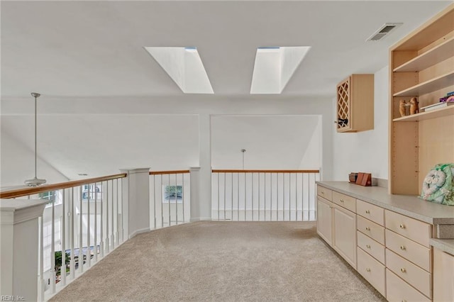 1010 Legends Way, Suffolk, VA 23435 - corridor featuring a skylight and light colored carpet