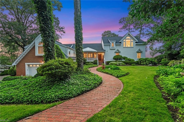1845 N Alanton Dr, Virginia Beach, VA 23454 - view of front facade with a yard, a garage, and brick siding