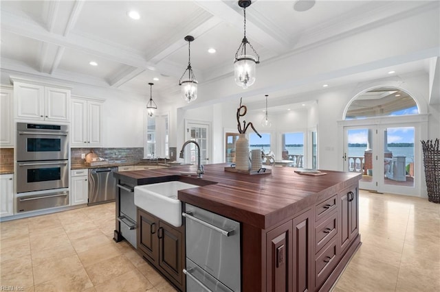 1845 N Alanton Dr, Virginia Beach, VA 23454 - kitchen featuring wood counters, stainless steel appliances, a warming drawer, tasteful backsplash, and coffered ceiling