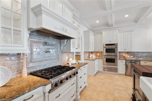 1845 N Alanton Dr, Virginia Beach, VA 23454 - kitchen with appliances with stainless steel finishes, premium range hood, white cabinetry, a warming drawer, and decorative backsplash
