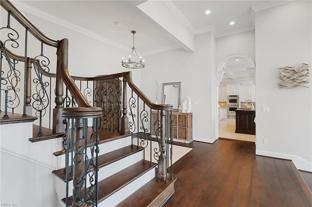 1845 N Alanton Dr, Virginia Beach, VA 23454 - stairs with hardwood / wood-style flooring, a chandelier, recessed lighting, crown molding, and arched walkways