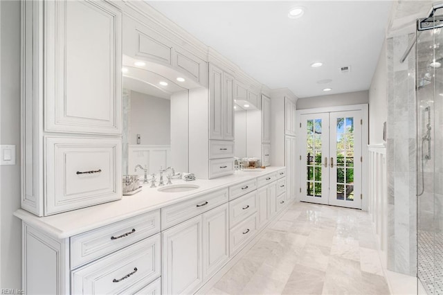 1845 N Alanton Dr, Virginia Beach, VA 23454 - bathroom featuring double vanity, an enclosed shower, french doors, a decorative wall, and marble finish floors