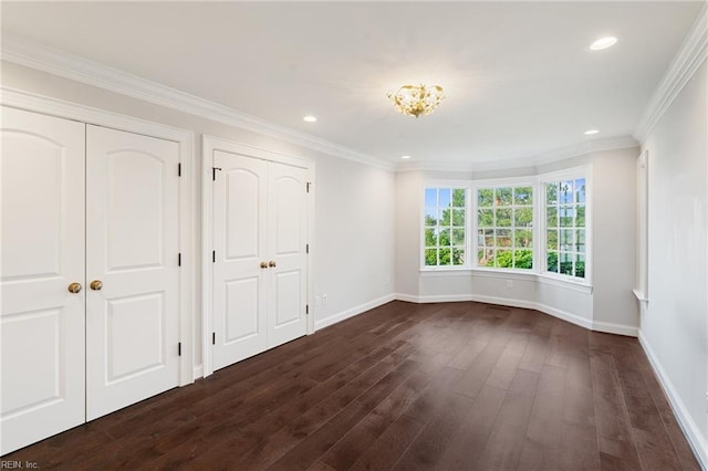 1845 N Alanton Dr, Virginia Beach, VA 23454 - unfurnished bedroom with dark wood finished floors, two closets, recessed lighting, and crown molding