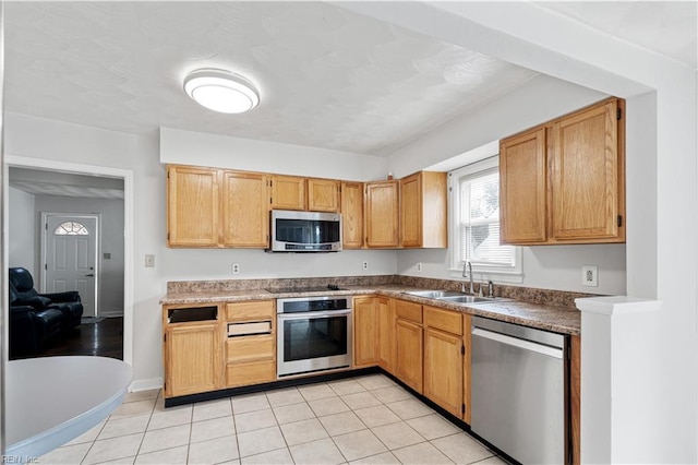 3917 Krick St, Norfolk, VA 23513 - kitchen featuring appliances with stainless steel finishes and light tile patterned flooring