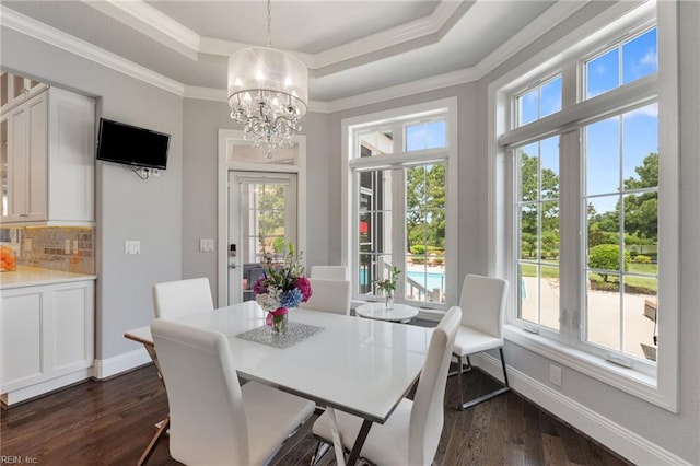 2716 Nestlebrook Trl, Virginia Beach, VA 23456 - dining room featuring a raised ceiling, crown molding, a chandelier, and dark wood-style floors