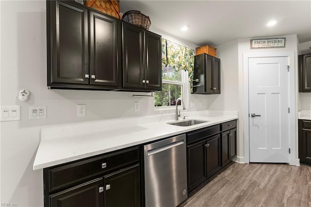 6957 Healy Ave, Gloucester, VA 23061 - kitchen with stainless steel dishwasher, light wood-type flooring, dark cabinetry, and recessed lighting
