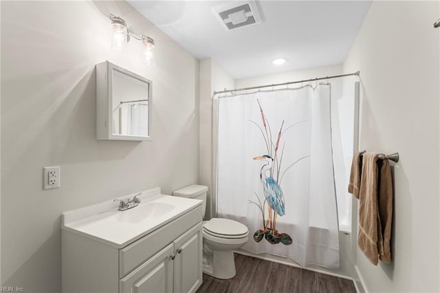 6957 Healy Ave, Gloucester, VA 23061 - full bathroom with vanity, wood finished floors, and shower / tub combo