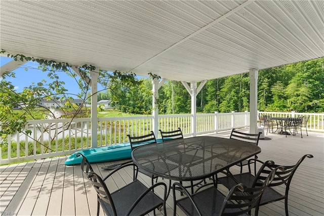 6957 Healy Ave, Gloucester, VA 23061 - deck with outdoor dining area and view of wooded area