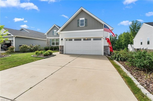 6957 Healy Ave, Gloucester, VA 23061 - craftsman-style home featuring board and batten siding, stone siding, driveway, and a front yard