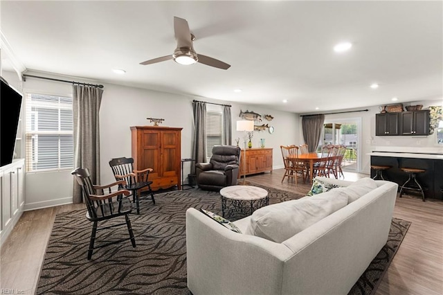 6957 Healy Ave, Gloucester, VA 23061 - living area featuring wood finished floors, ceiling fan, and recessed lighting