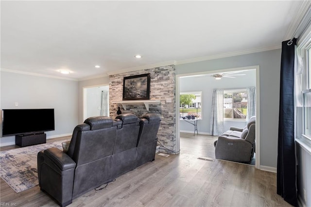 7600 Bridgette Ln, Norfolk, VA 23518 - living room featuring ornamental molding, light wood-type flooring, a stone fireplace, recessed lighting, and ceiling fan