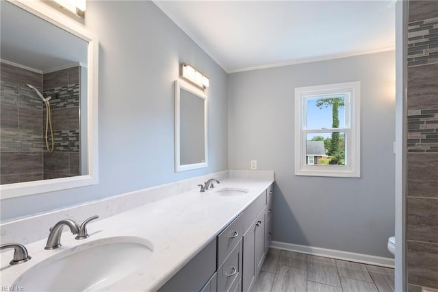 7600 Bridgette Ln, Norfolk, VA 23518 - bathroom with double vanity, ornamental molding, and a tile shower