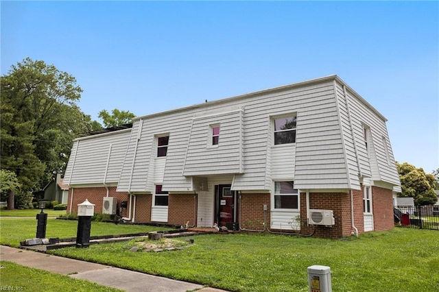 7600 Bridgette Ln, Norfolk, VA 23518 - view of property featuring brick siding, a front yard, and a wall unit AC