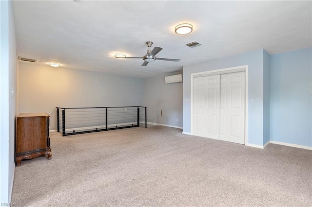 7600 Bridgette Ln, Norfolk, VA 23518 - unfurnished bedroom with carpet floors, a wall unit AC, a closet, and a ceiling fan
