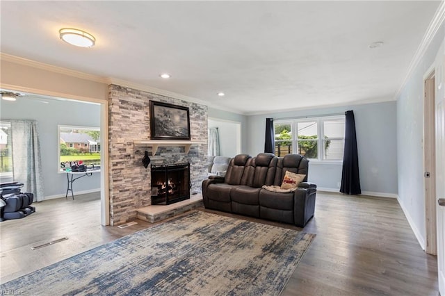 7600 Bridgette Ln, Norfolk, VA 23518 - living room featuring wood finished floors, a fireplace, ornamental molding, and recessed lighting