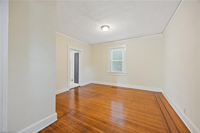 5004 Powhatan Ave, Norfolk, VA 23508 - spare room with a textured ceiling, wood finished floors, and crown molding
