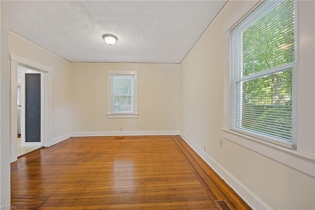 5004 Powhatan Ave, Norfolk, VA 23508 - spare room featuring hardwood / wood-style floors and a textured ceiling