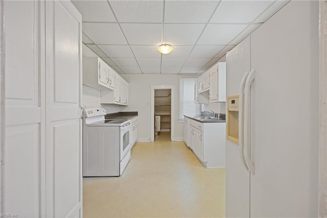 5004 Powhatan Ave, Norfolk, VA 23508 - kitchen featuring white appliances, a drop ceiling, white cabinetry, and dark countertops