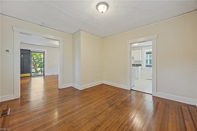 5004 Powhatan Ave, Norfolk, VA 23508 - spare room featuring wood-type flooring and a textured ceiling