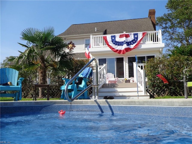 1757 Mill Landing Rd, Virginia Beach, VA 23457 - view of front facade featuring a balcony and a chimney