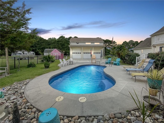 1757 Mill Landing Rd, Virginia Beach, VA 23457 - pool at dusk featuring a patio area and an outdoor structure