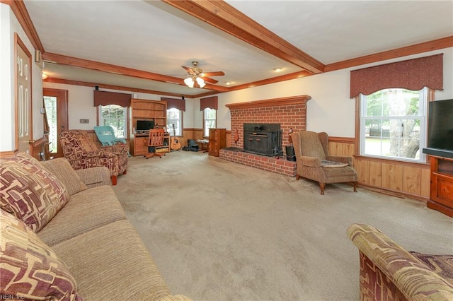 1757 Mill Landing Rd, Virginia Beach, VA 23457 - living area with carpet, wainscoting, beam ceiling, a wood stove, and ceiling fan