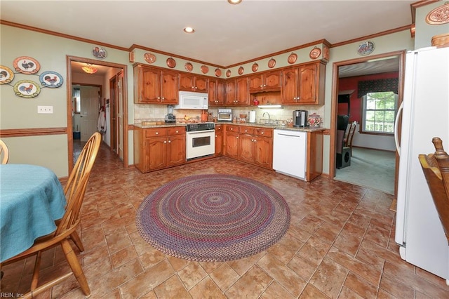 1757 Mill Landing Rd, Virginia Beach, VA 23457 - kitchen with white appliances, backsplash, crown molding, brown cabinetry, and recessed lighting