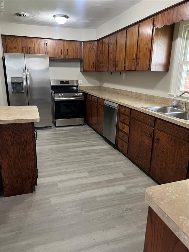 2453 Malden Ave, Norfolk, VA 23518 - kitchen with stainless steel appliances, light countertops, and light wood-style floors