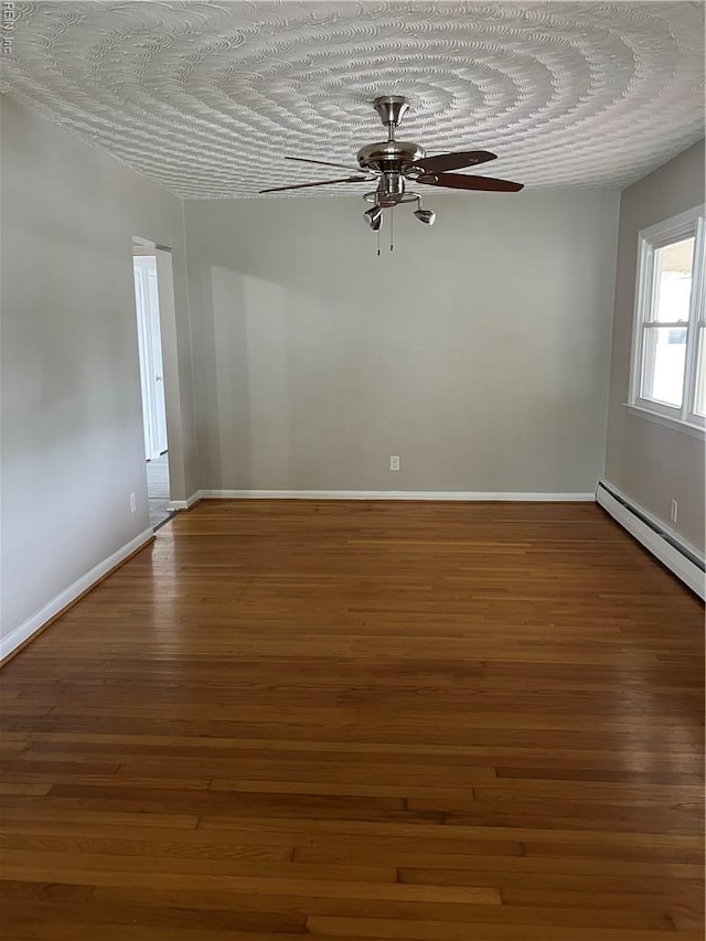 2453 Malden Ave, Norfolk, VA 23518 - empty room featuring ceiling fan, wood finished floors, and baseboard heating
