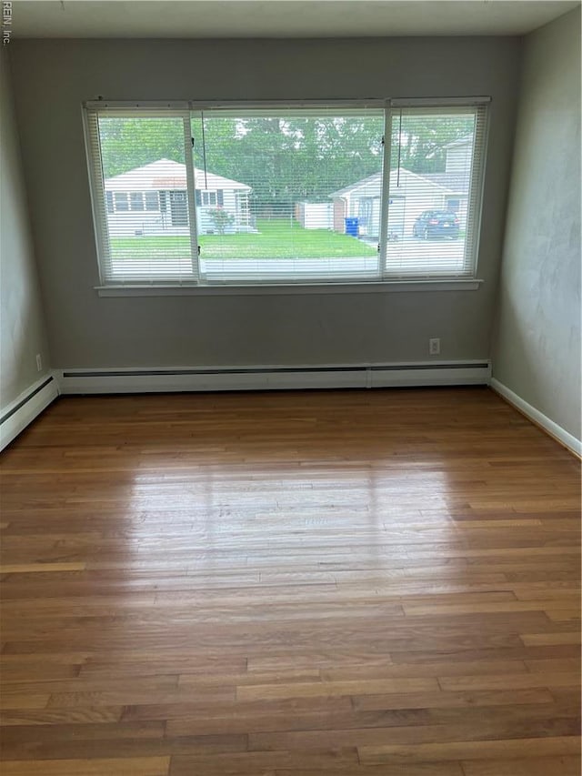 2453 Malden Ave, Norfolk, VA 23518 - unfurnished room with wood finished floors and baseboard heating