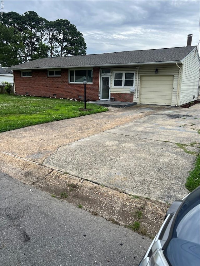2453 Malden Ave, Norfolk, VA 23518 - single story home with an attached garage, concrete driveway, brick siding, and a front lawn