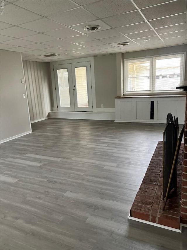 2453 Malden Ave, Norfolk, VA 23518 - unfurnished living room featuring a drop ceiling, french doors, and wood finished floors