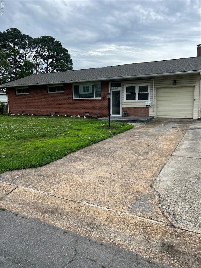2453 Malden Ave, Norfolk, VA 23518 - single story home featuring an attached garage, brick siding, driveway, and a front yard