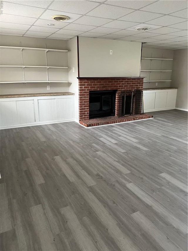 2453 Malden Ave, Norfolk, VA 23518 - unfurnished living room with wood finished floors, a fireplace, and a paneled ceiling