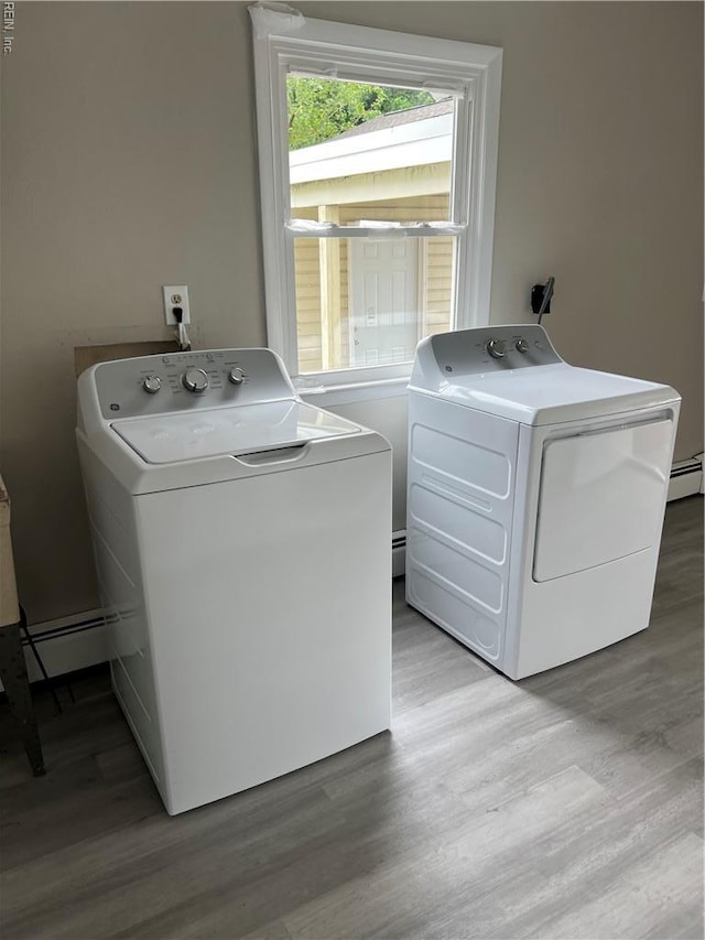 2453 Malden Ave, Norfolk, VA 23518 - washroom with separate washer and dryer, light wood finished floors, and a baseboard heating unit