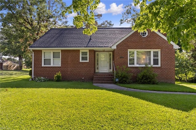2220 Rodgers St, Chesapeake, VA 23324 - view of front of property with entry steps, brick siding, a front lawn, and a shingled roof