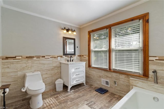2220 Rodgers St, Chesapeake, VA 23324 - full bath with tile walls, vanity, a bath, crown molding, and a wainscoted wall