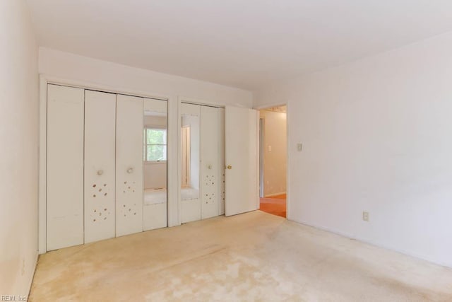 205 Haradd Ln, Williamsburg, VA 23188 - unfurnished bedroom with multiple closets and carpet flooring