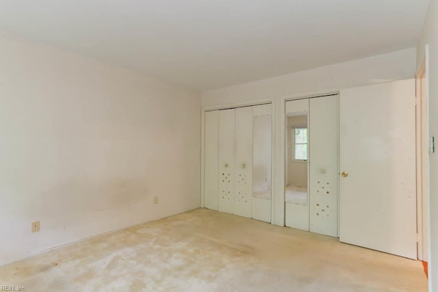 205 Haradd Ln, Williamsburg, VA 23188 - unfurnished bedroom featuring two closets and light colored carpet
