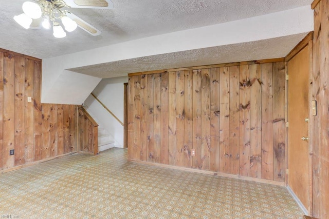 205 Haradd Ln, Williamsburg, VA 23188 - bonus room featuring wood walls, stairs, a textured ceiling, and a ceiling fan