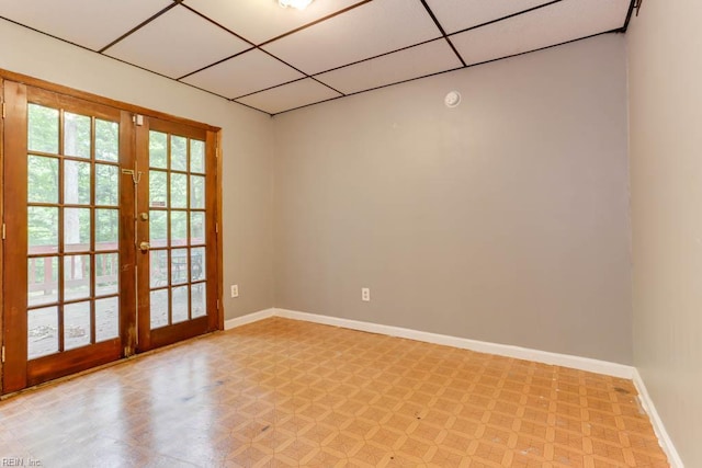 205 Haradd Ln, Williamsburg, VA 23188 - unfurnished room featuring french doors, light flooring, and a paneled ceiling