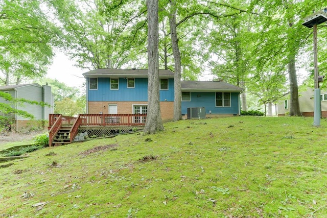 205 Haradd Ln, Williamsburg, VA 23188 - back of house with a wooden deck, a lawn, and brick siding