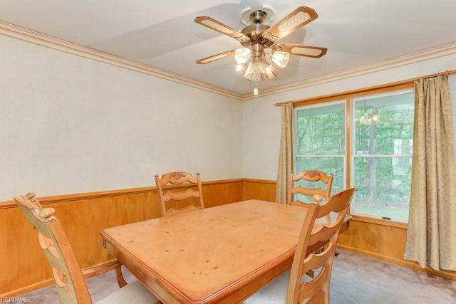 205 Haradd Ln, Williamsburg, VA 23188 - dining room featuring light colored carpet, crown molding, a wainscoted wall, wooden walls, and ceiling fan