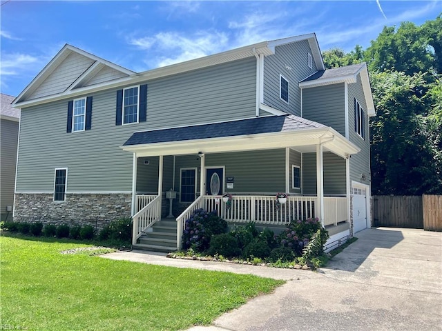 3109 Pleasant Ave, Norfolk, VA 23518 - view of front facade with covered porch, driveway, a garage, and stone siding