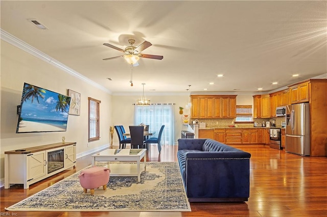 3109 Pleasant Ave, Norfolk, VA 23518 - living area featuring crown molding, ceiling fan, a chandelier, dark wood-type flooring, and recessed lighting