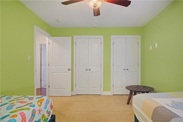 3109 Pleasant Ave, Norfolk, VA 23518 - bedroom with two closets, light carpet, and ceiling fan