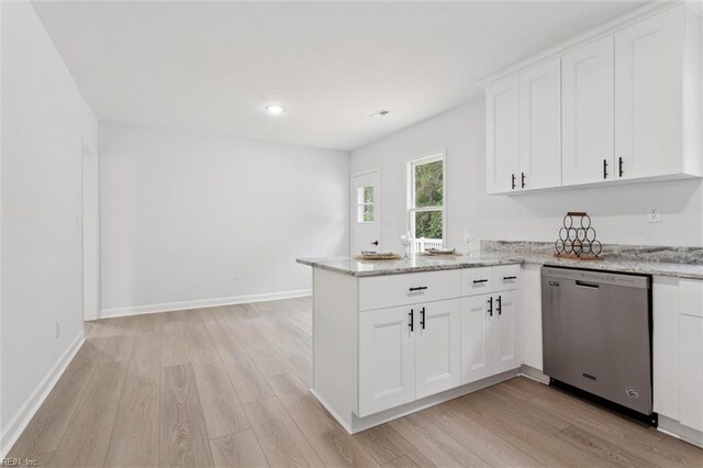 13067 Poor House Rd, Windsor, VA 23487 - kitchen with stainless steel dishwasher, light wood-style flooring, a peninsula, white cabinetry, and recessed lighting